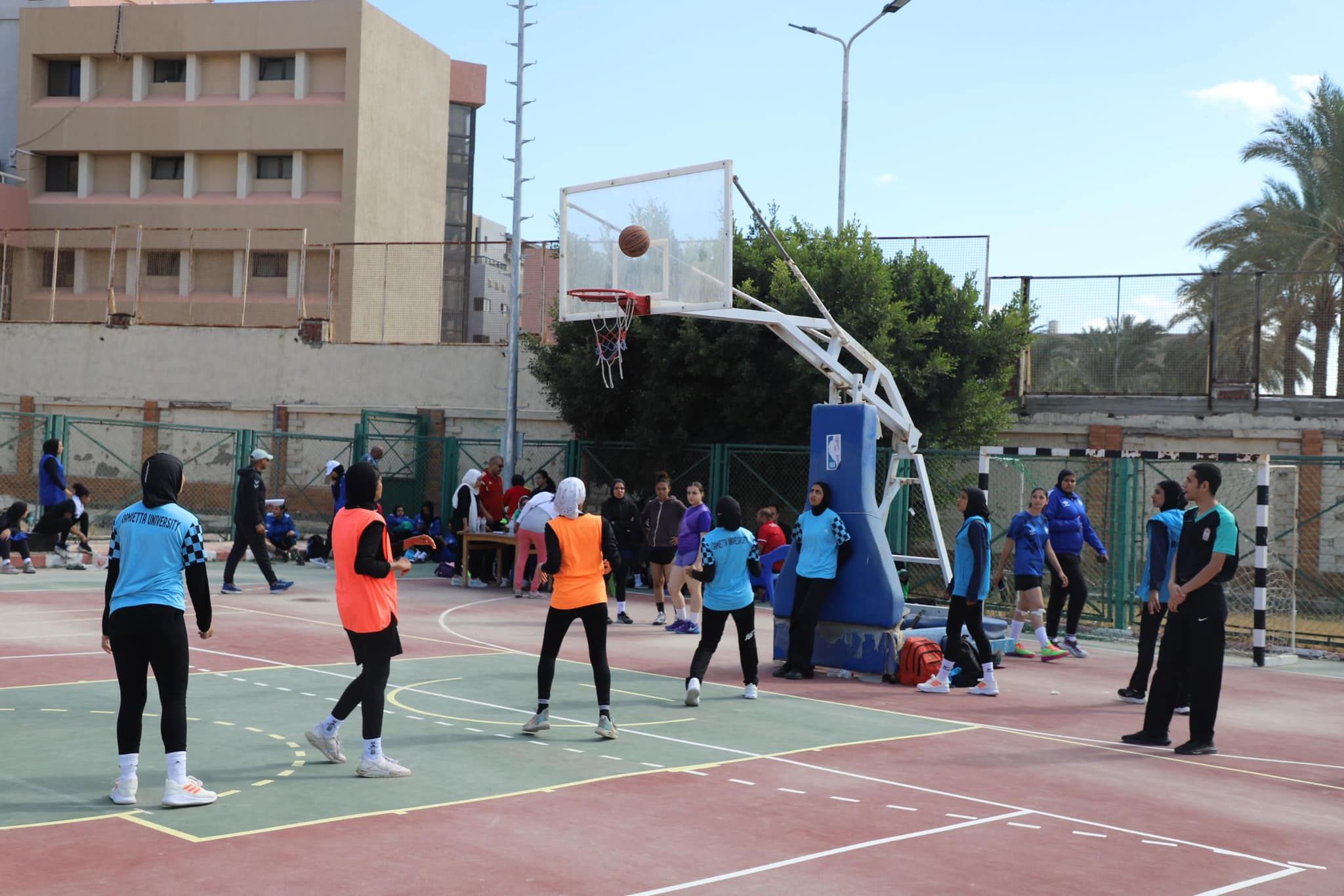 May be an image of 14 people and people playing basketball